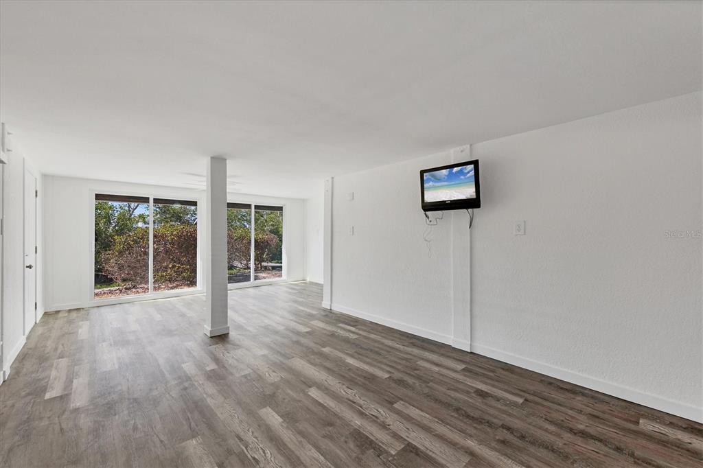 331 Bocilla Drive Boca Grande, FL 33921 - Photo 23 of 34 a view of a room with wooden floor and window