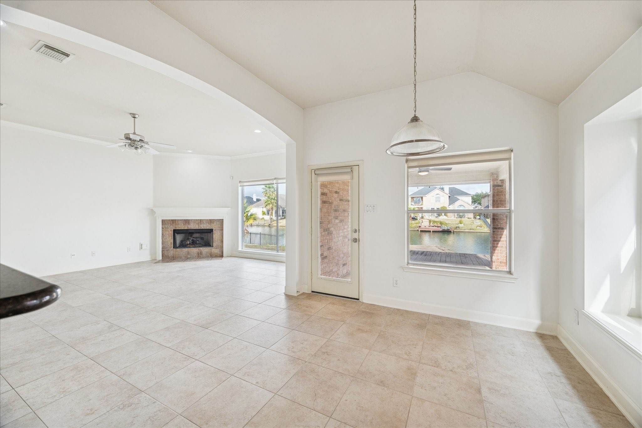 18110 Dunoon Bay Point Court Cypress, TX 77429 - Photo 11 of 27 an empty room with windows and fireplace