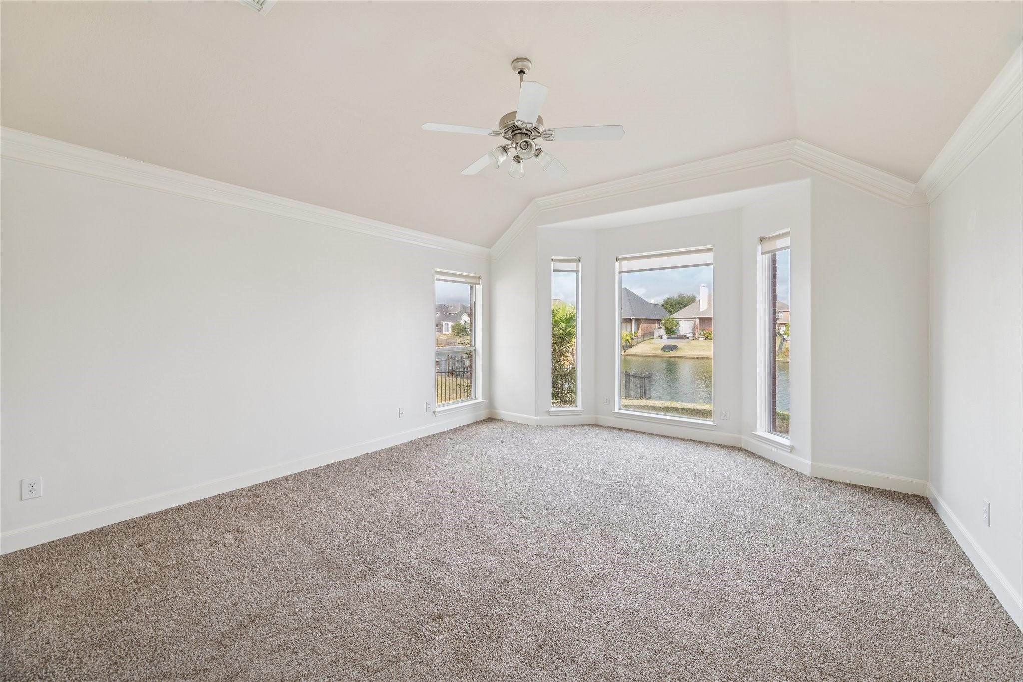 18110 Dunoon Bay Point Court Cypress, TX 77429 - Photo 14 of 27 an empty room with windows and fan