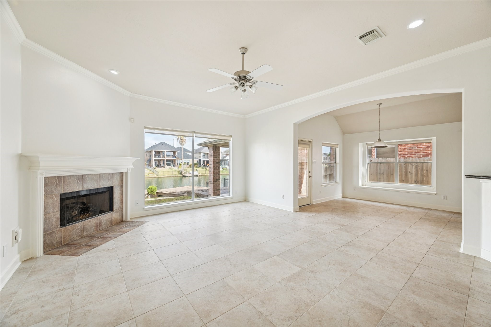 18110 Dunoon Bay Point Court Cypress, TX 77429 - Photo 4 of 27 a view of an empty room with a fireplace and a window
