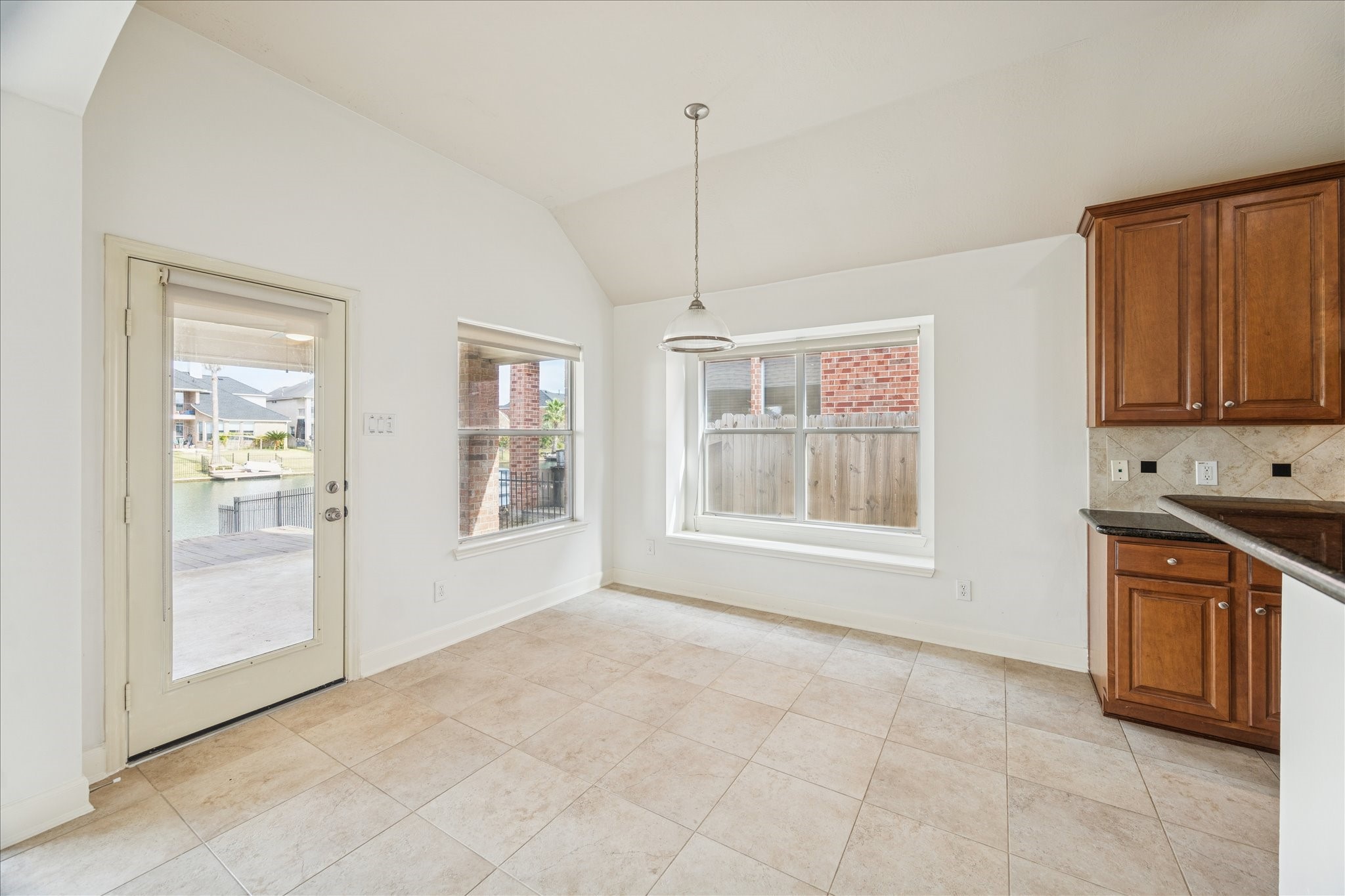 18110 Dunoon Bay Point Court Cypress, TX 77429 - Photo 8 of 27 a view of an empty room with a kitchen