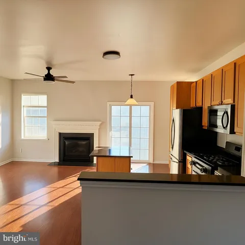 a kitchen with stainless steel appliances a stove and a refrigerator