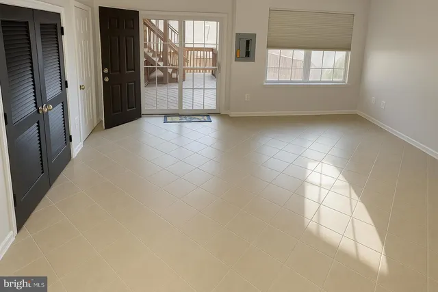 a white toilet sitting next to a white sink