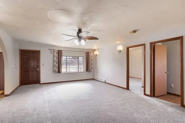 a view of an empty room with a window