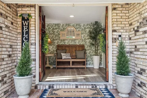 a living room with furniture a fireplace and city view