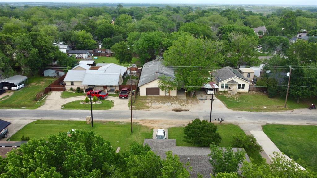 417 South Prairie Street Pilot Point, TX 76258 - Photo 3 of 7 an aerial view of a house with garden