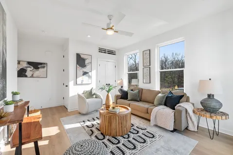 a living room with furniture and a window