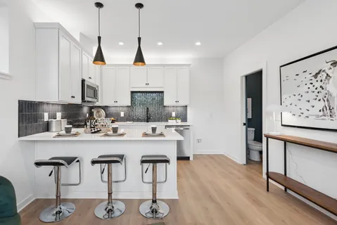 a view of kitchen island with furniture and wooden floor