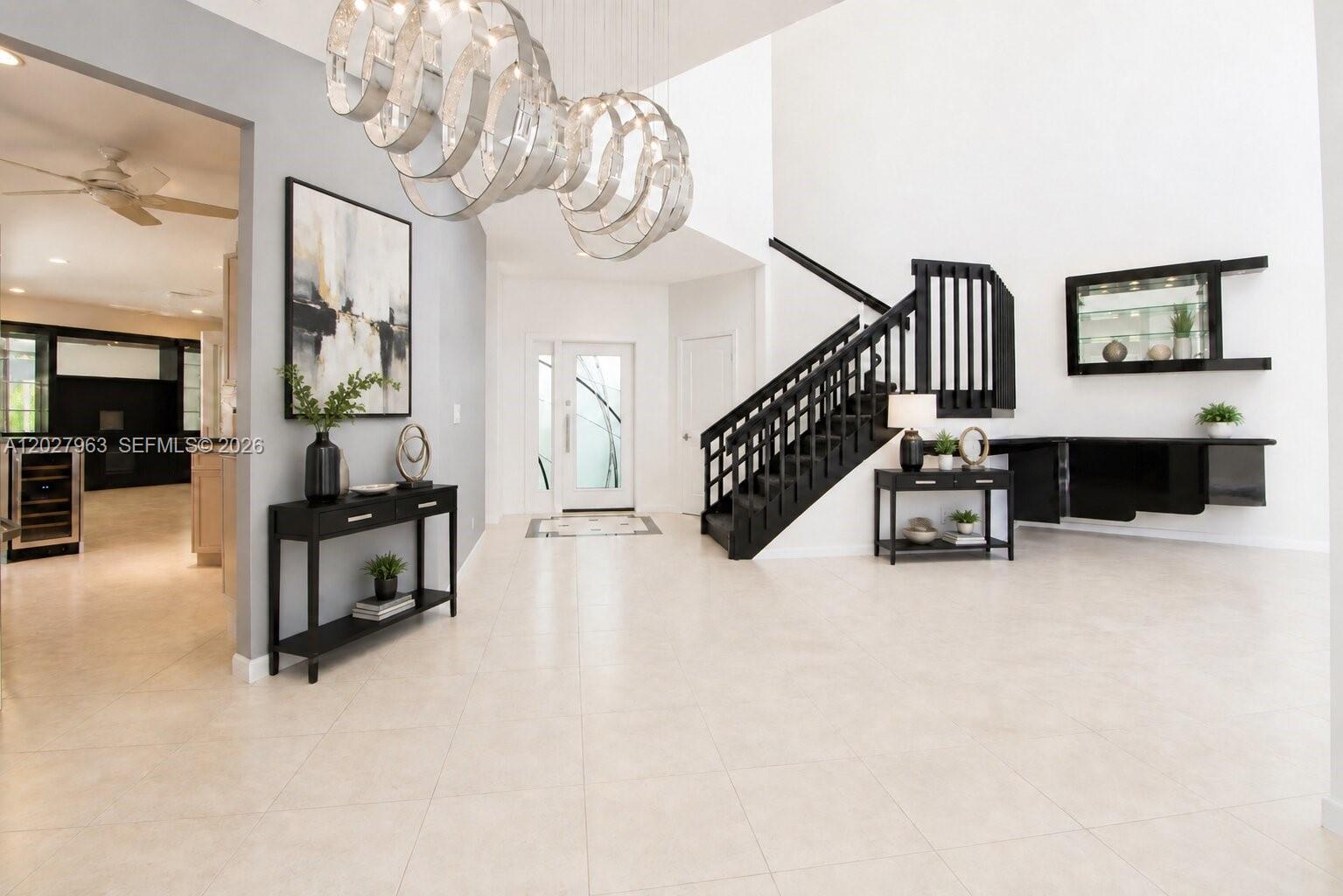 6646 Northwest 25th Terrace Boca Raton, FL 33496 - Photo 5 of 48 a living room with furniture and a chandelier