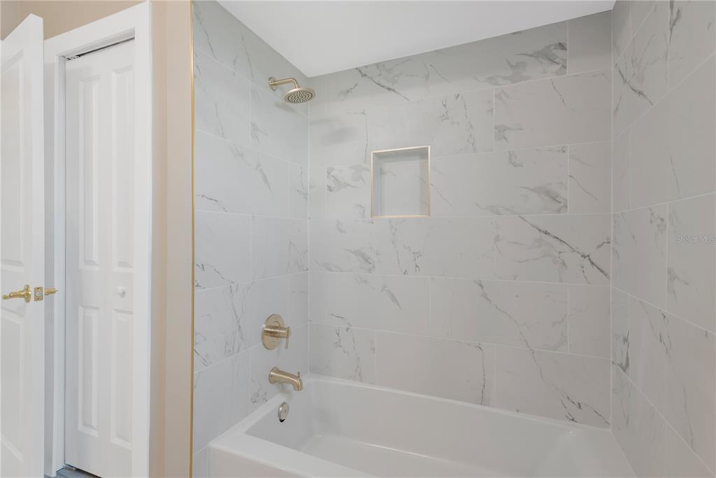 9840 San Sebastian Way Port Richey, FL 34668 - Photo 23 of 45 a bathroom with a bathtub