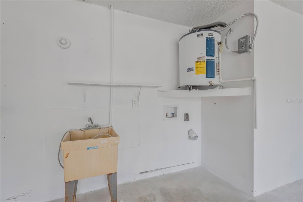 9840 San Sebastian Way Port Richey, FL 34668 - Photo 24 of 45 a bathroom with a sink and mirror