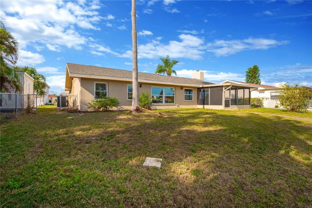 9840 San Sebastian Way Port Richey, FL 34668 - Photo 27 of 45 a view of a house with a big yard