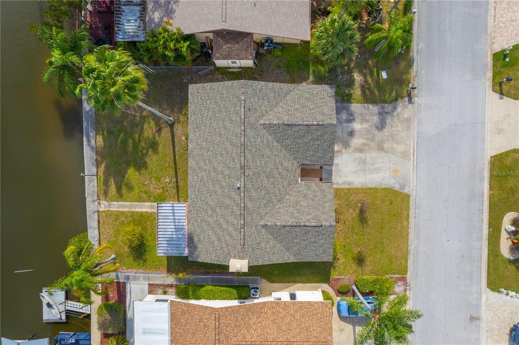 9840 San Sebastian Way Port Richey, FL 34668 - Photo 36 of 45 an aerial view of a house with a yard