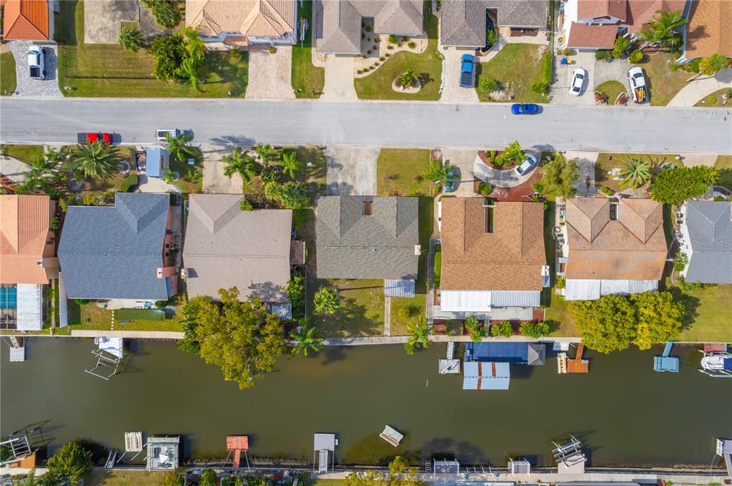 9840 San Sebastian Way Port Richey, FL 34668 - Photo 38 of 45 an aerial view of residential house with outdoor space and swimming pool