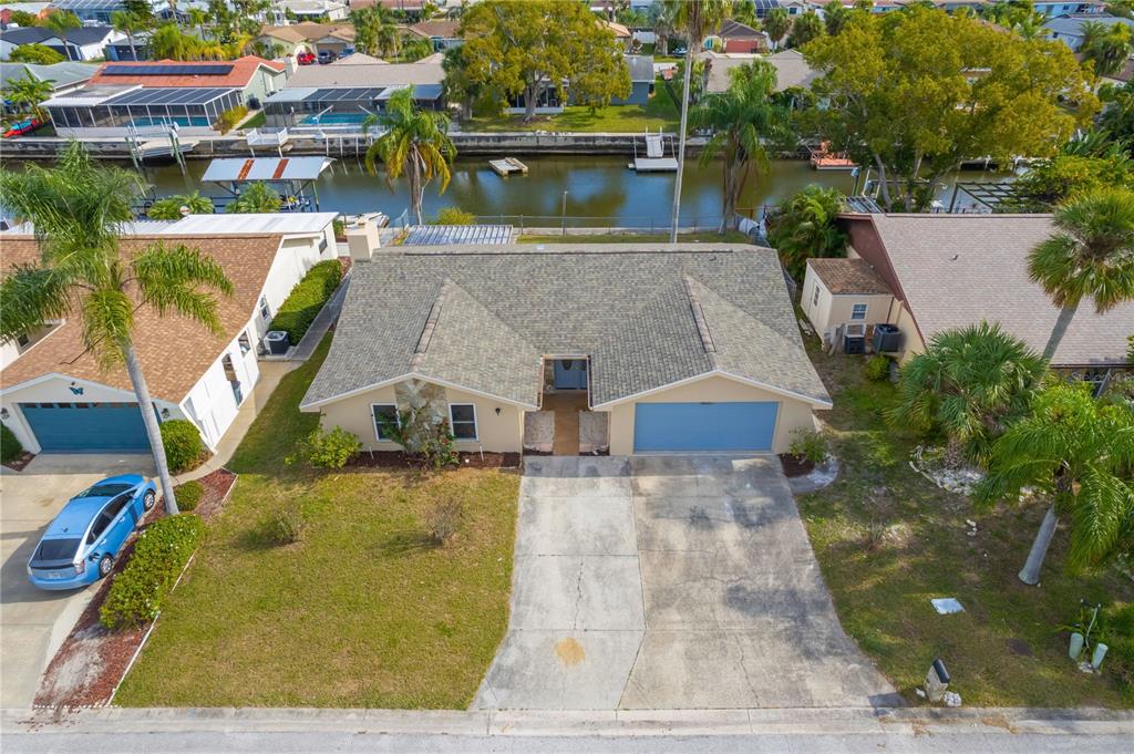 9840 San Sebastian Way Port Richey, FL 34668 - Photo 4 of 45 an aerial view of a house with a yard