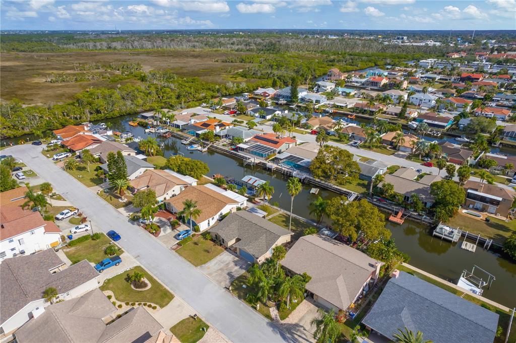 9840 San Sebastian Way Port Richey, FL 34668 - Photo 42 of 45 an aerial view of ocean and residential houses with outdoor space