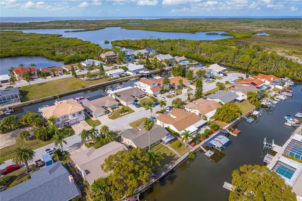 9840 San Sebastian Way Port Richey, FL 34668 - Photo 43 of 45 an aerial view of residential houses with outdoor space
