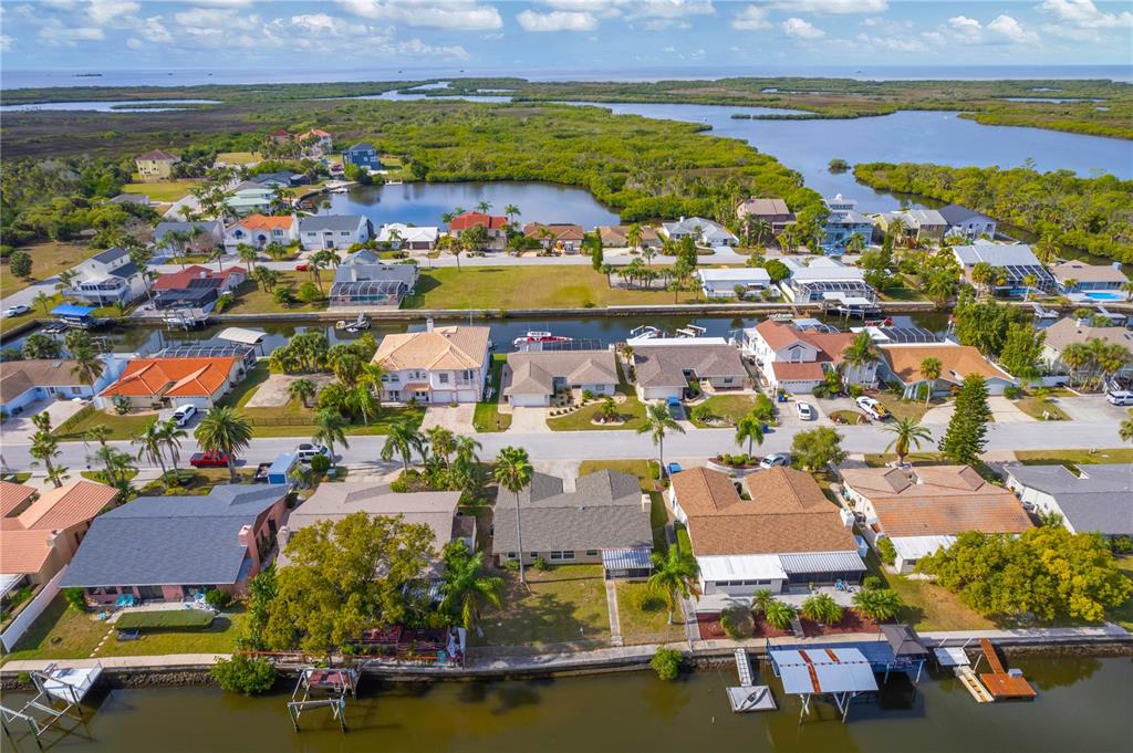 9840 San Sebastian Way Port Richey, FL 34668 - Photo 44 of 45 an aerial view of residential houses with outdoor space