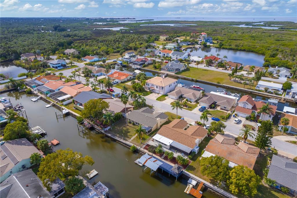 9840 San Sebastian Way Port Richey, FL 34668 - Photo 45 of 45 an aerial view of residential houses with outdoor space