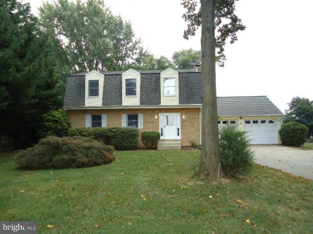 6838 Warfield Road Gaithersburg, MD 20882 - Photo 1 of 17 a view of a house with a garden