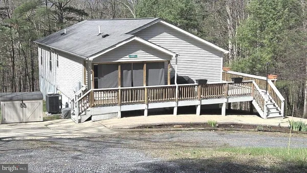 a house with trees in the background