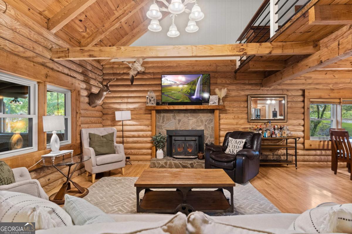 224 Loch Way Eatonton, GA 31024 - Photo 18 of 59 a living room with furniture and a fireplace