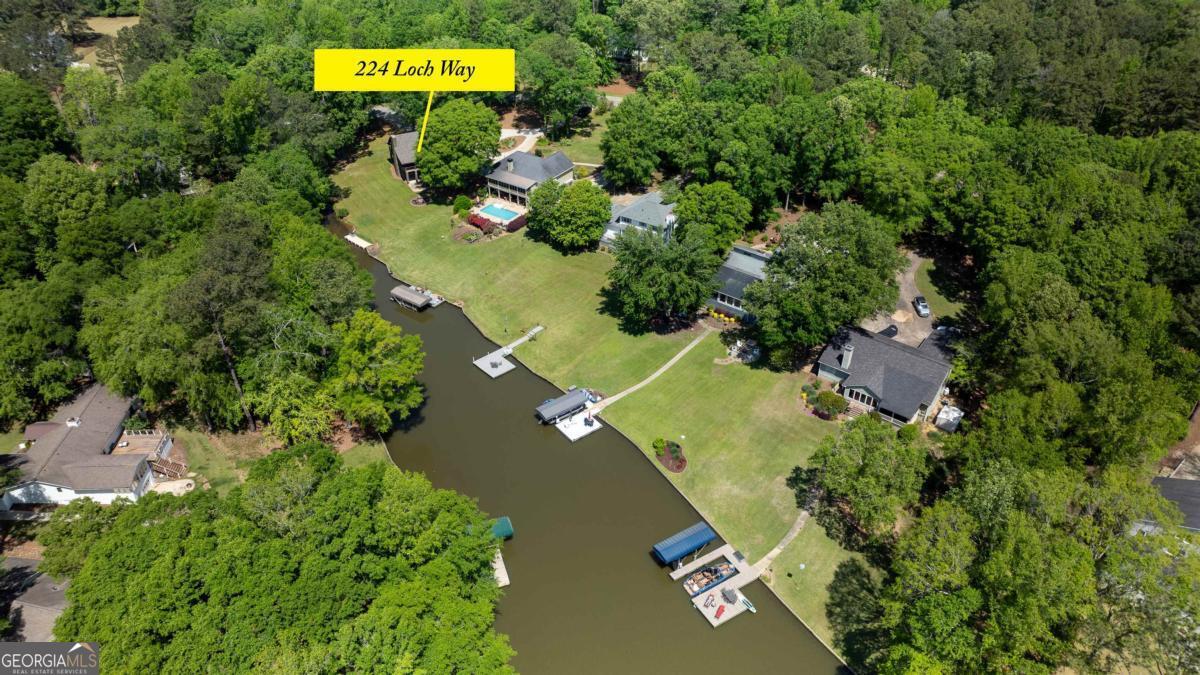 224 Loch Way Eatonton, GA 31024 - Photo 59 of 59 an aerial view of a house with a yard and swimming pool