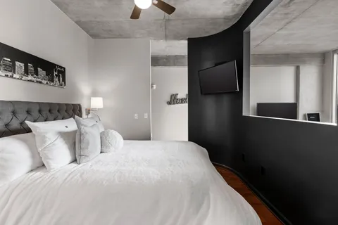 a bedroom with a bed and a walk in closet