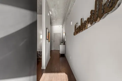 a view of a hallway with a white walls