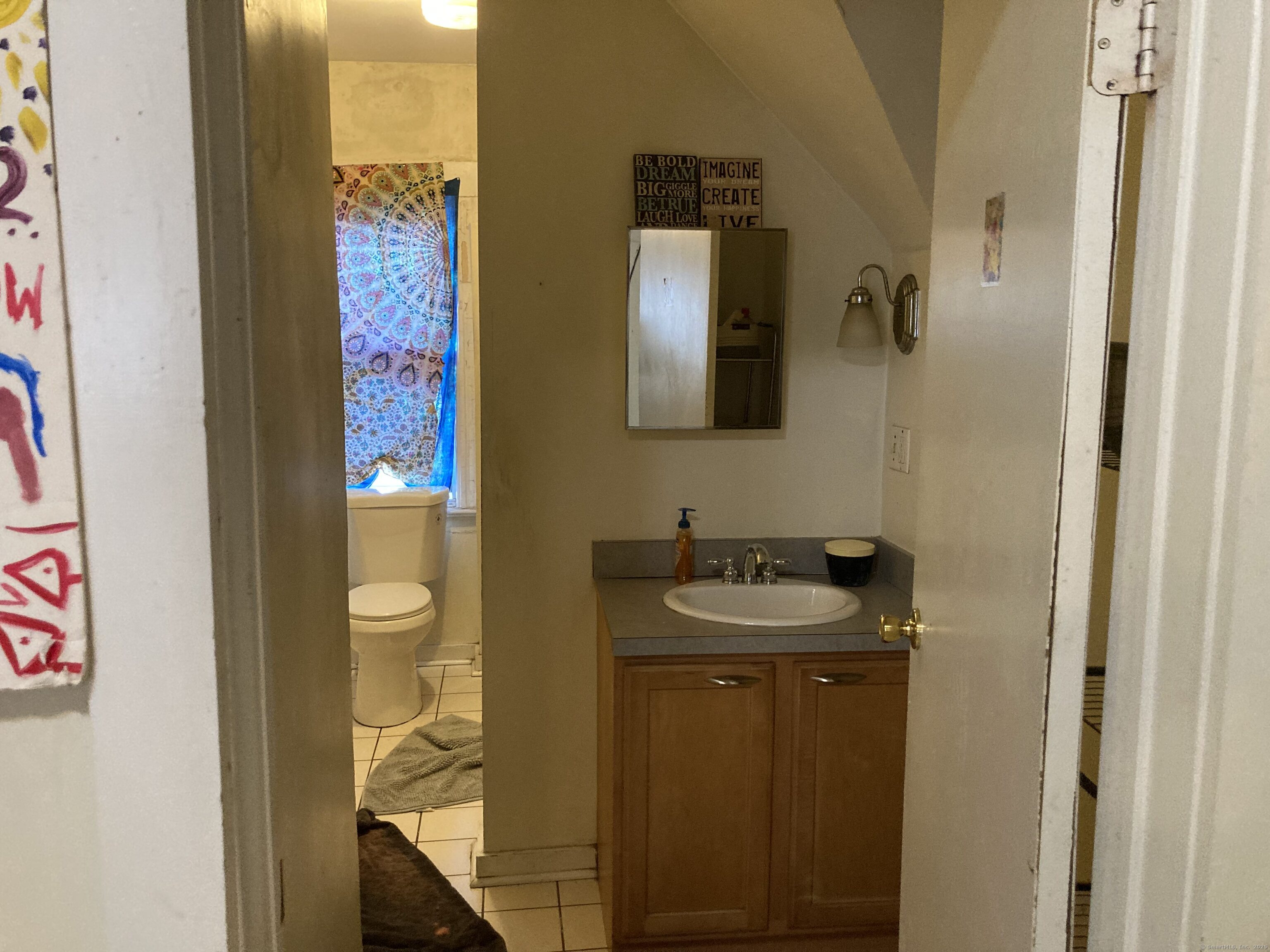 225 Winthrop Avenue New Haven, CT 06511 - Photo 27 of 36 a bathroom with a sink and a mirror