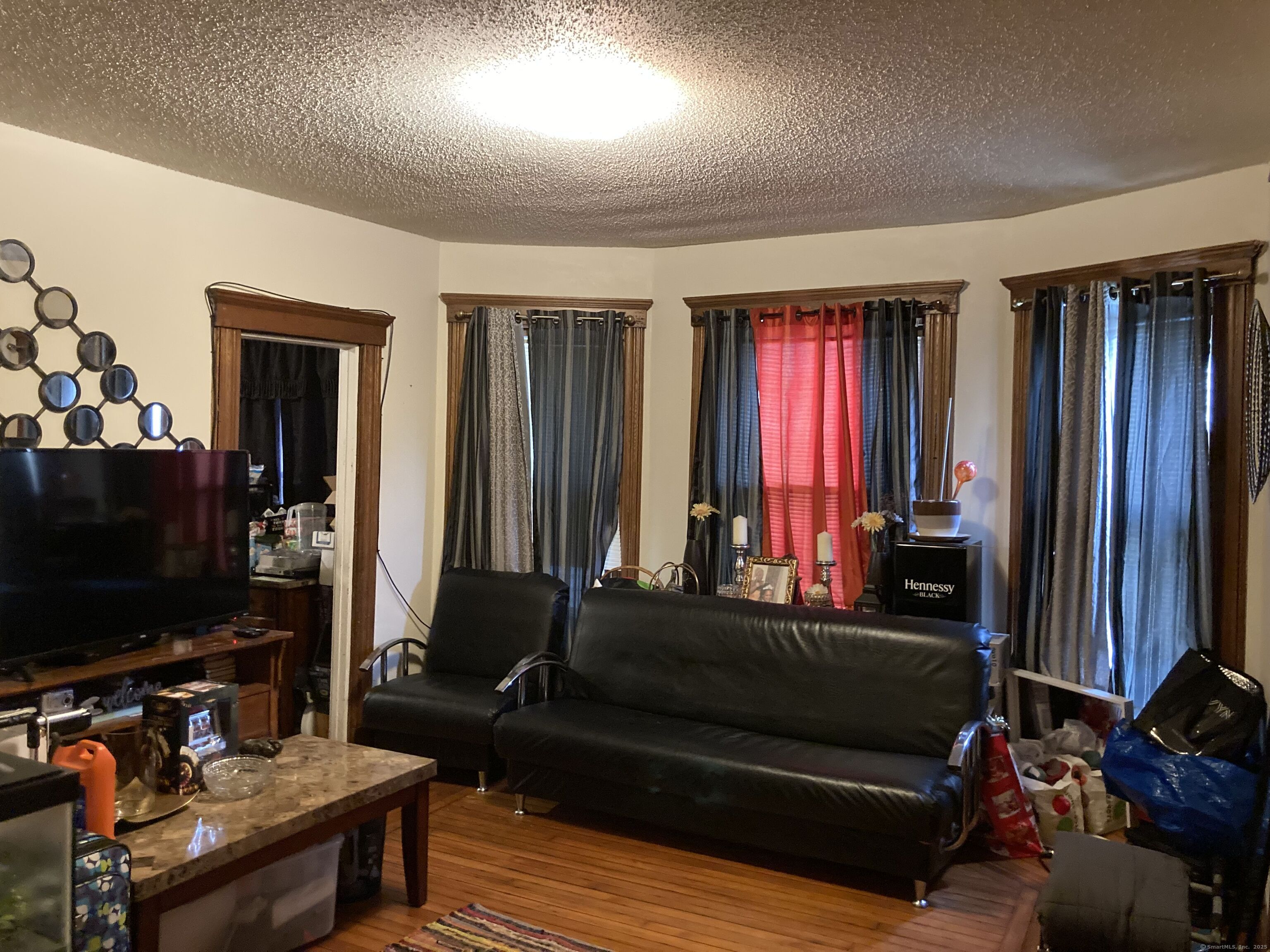 225 Winthrop Avenue New Haven, CT 06511 - Photo 4 of 36 a living room with furniture a flat screen tv and a window