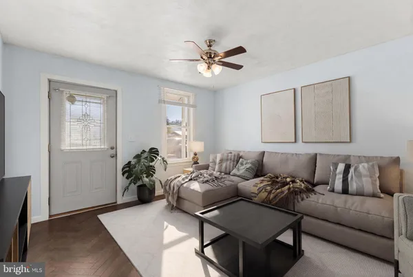 a living room with furniture and a window