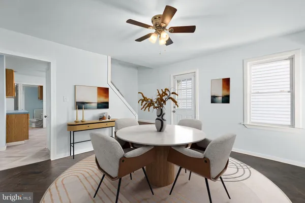 a dining room with furniture and window