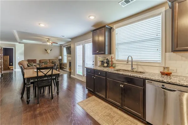 a kitchen with lots of counter top space and dining table