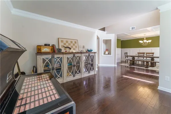 a view of kitchen with furniture and wooden floor