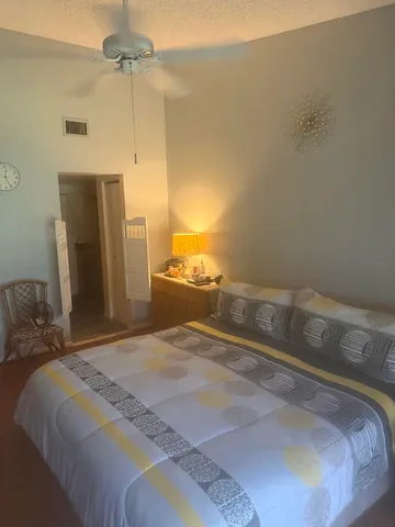 a bedroom with a bed and a walk in closet