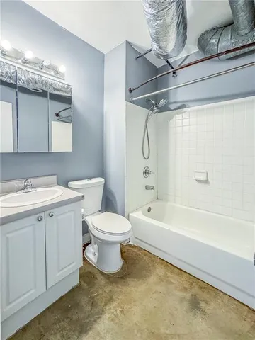 a bathroom with a toilet sink and bathtub