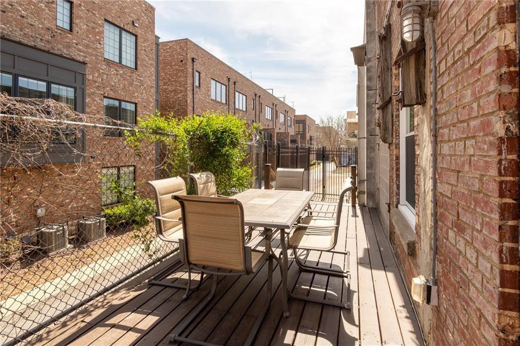244 Peters Street Southwest, Unit 10 Atlanta, GA 30313 - Photo 30 of 38 a view of a patio with a table and chairs