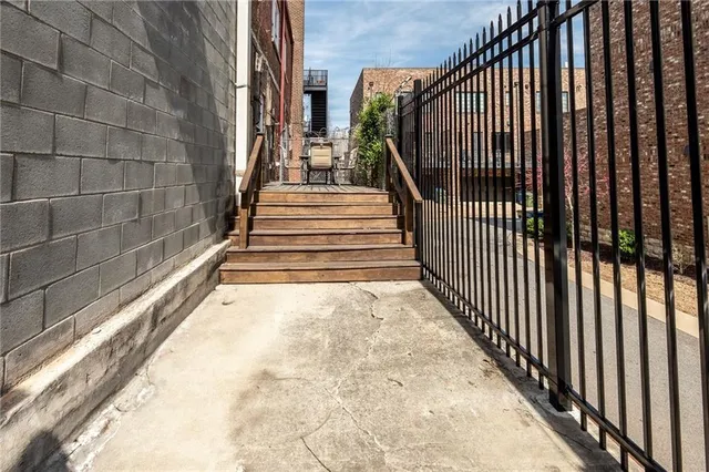 a view of staircase with wooden floor and a window