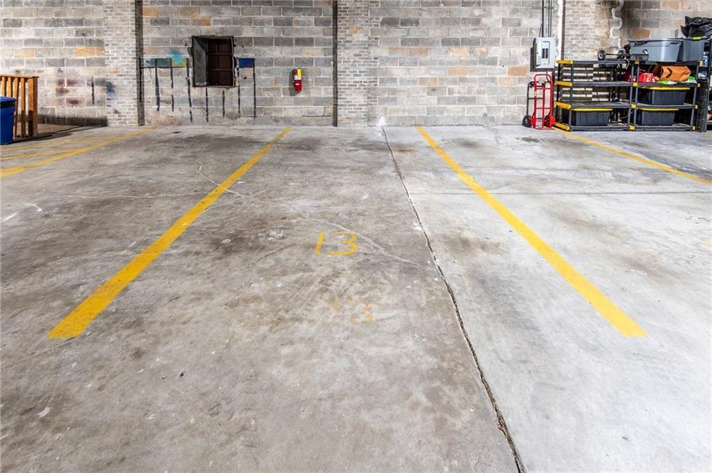244 Peters Street Southwest, Unit 10 Atlanta, GA 30313 - Photo 36 of 38 a view of a swimming pool with a lounge chairs
