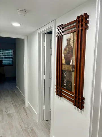 a view of front door with washer and dryer