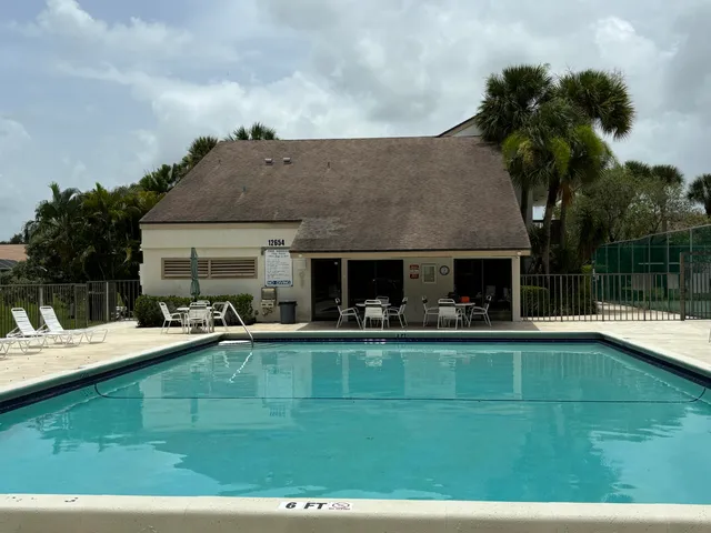 a view of a house with swimming pool