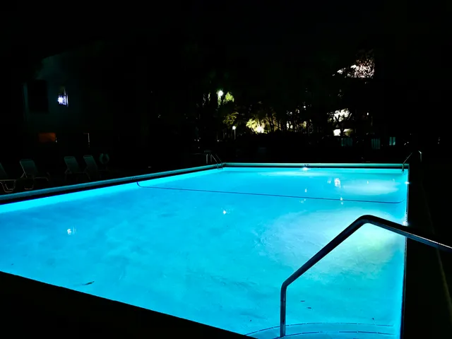 a view of an outdoor space and basketball court