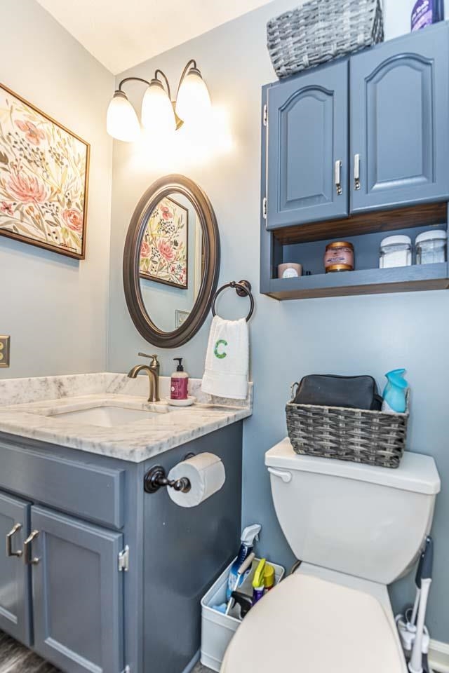 1803 Curve Woodville Road Ripley, TN 38063 - Photo 8 of 23 a bathroom with a toilet a sink and a stove