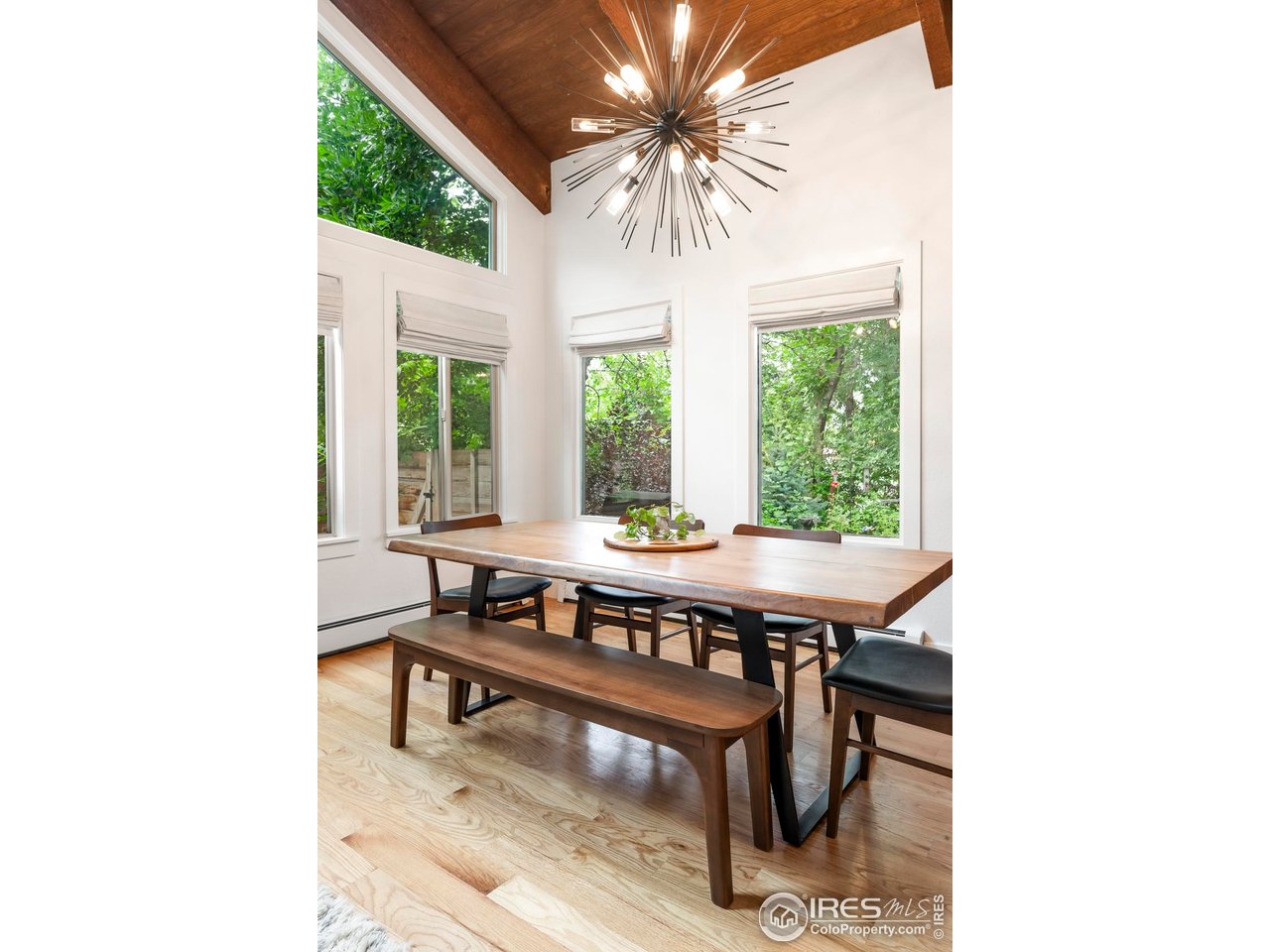 2589 Alkire Street Golden, CO 80401 - Photo 11 of 50 a dining room with a large window table and chairs