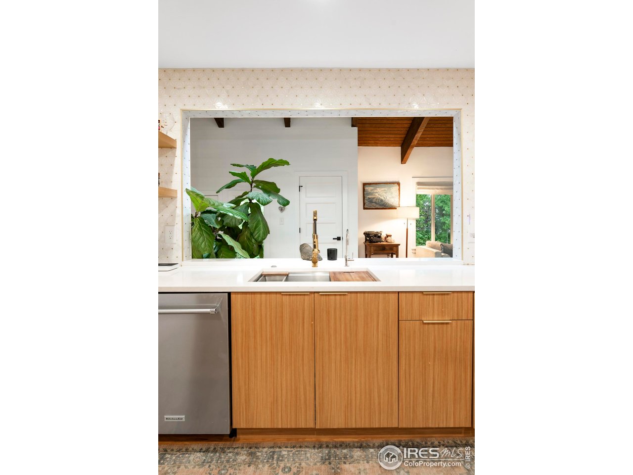 2589 Alkire Street Golden, CO 80401 - Photo 21 of 50 a living room with a sink and a potted plant