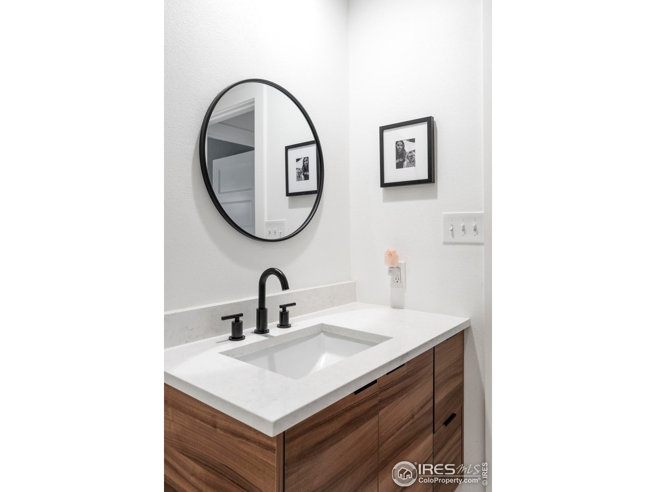 2589 Alkire Street Golden, CO 80401 - Photo 29 of 50 a bathroom with a sink and a mirror