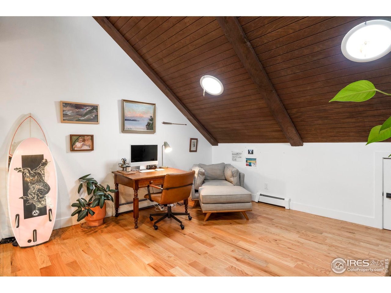2589 Alkire Street Golden, CO 80401 - Photo 32 of 50 a living room with furniture and a flat screen tv