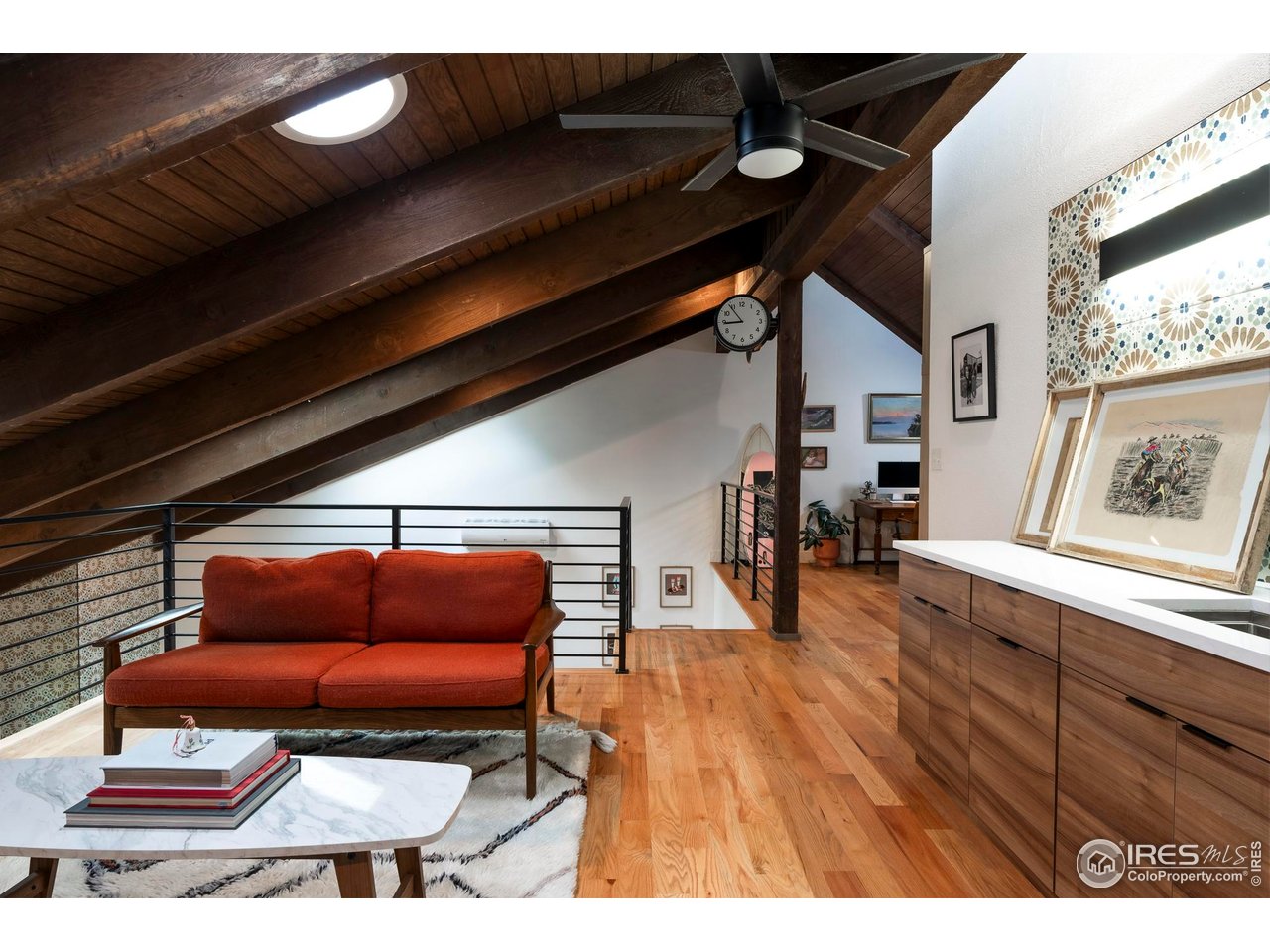 2589 Alkire Street Golden, CO 80401 - Photo 34 of 50 a room with furniture and wooden floor