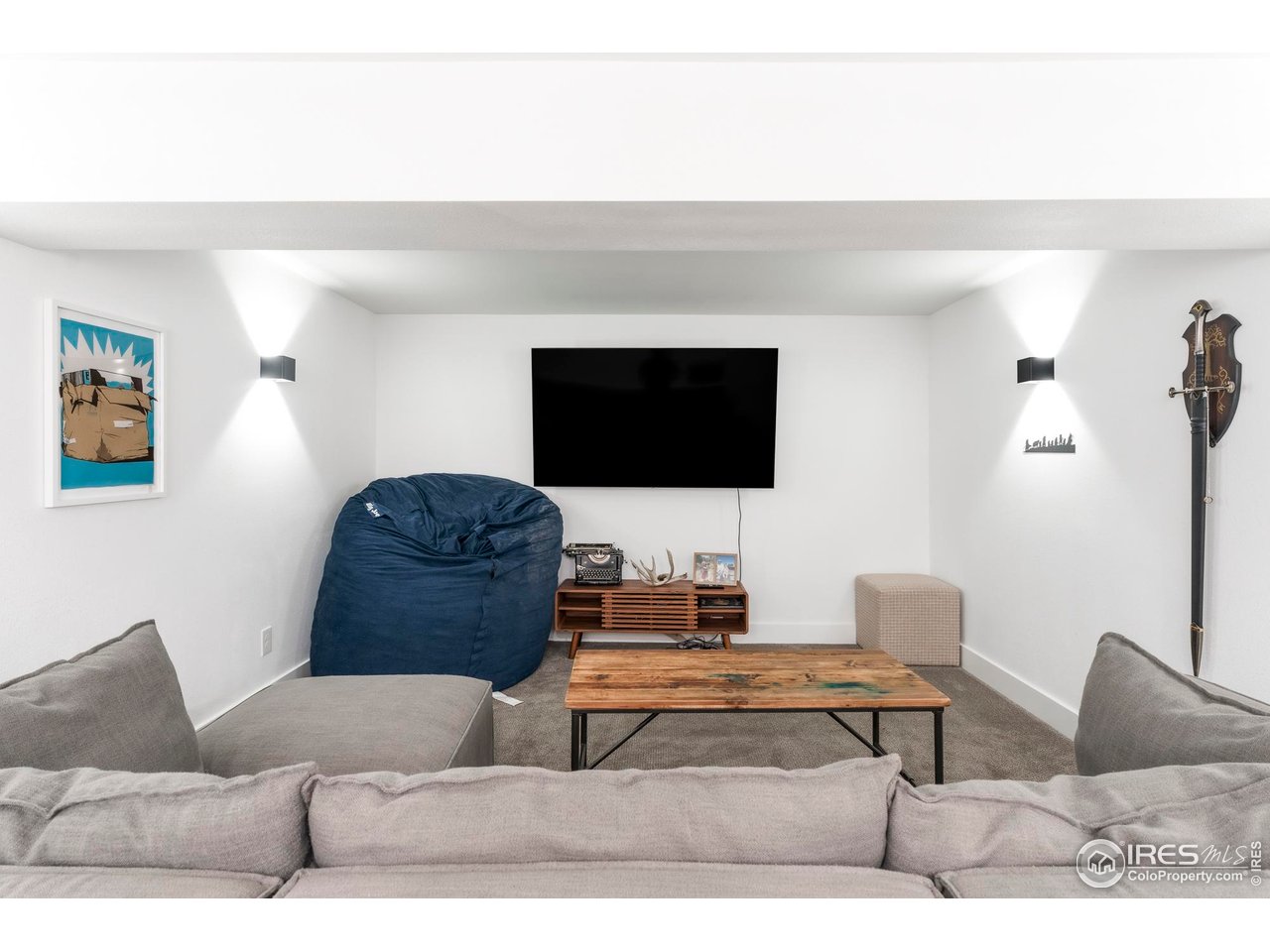 2589 Alkire Street Golden, CO 80401 - Photo 46 of 50 a living room with furniture and a flat screen tv